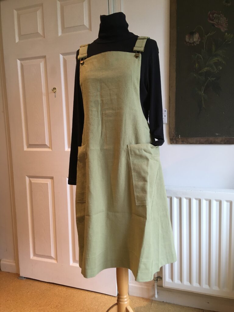 Sage green linen pinafore dress