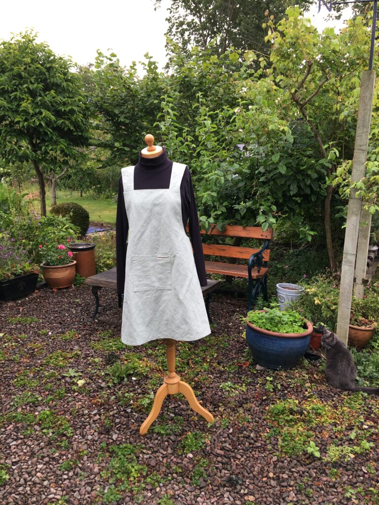 Front of Pinny no 178 in sage green linen