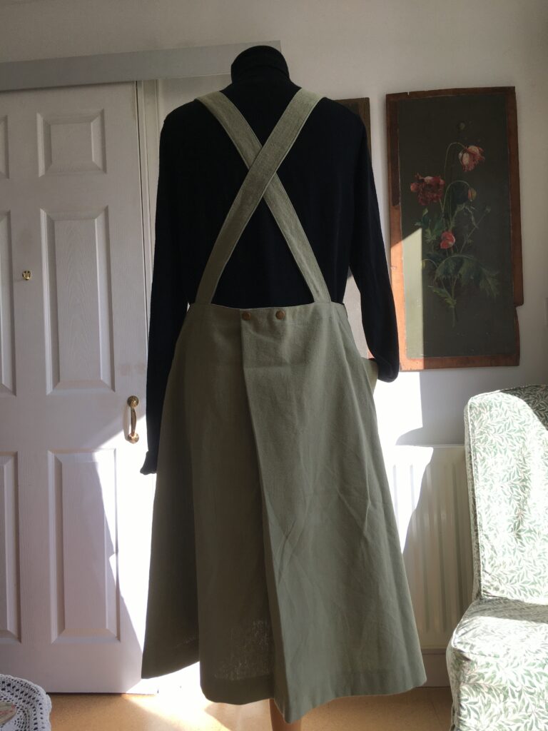 Rear view of sage linen pinafore dress