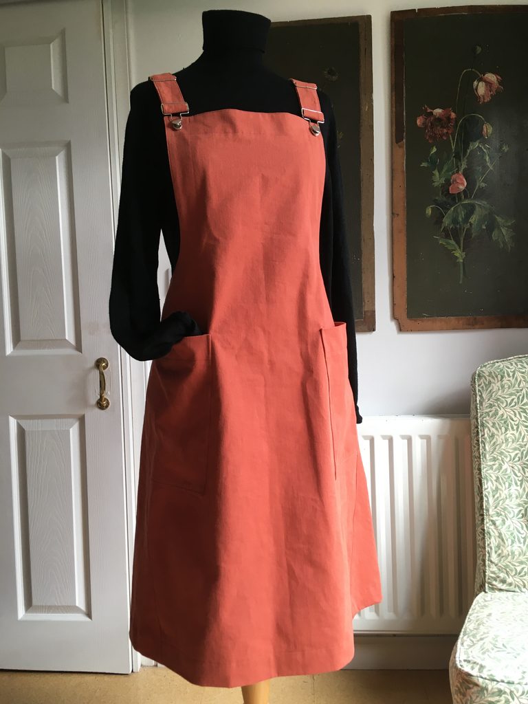 Terracotta-coloured pinafore dress