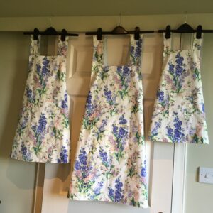A 'family' trio of floral pinnies