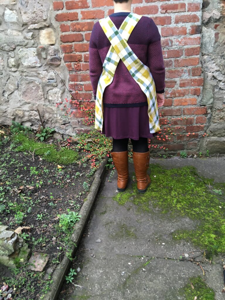 A size 14 to 16 person modelling a pinny